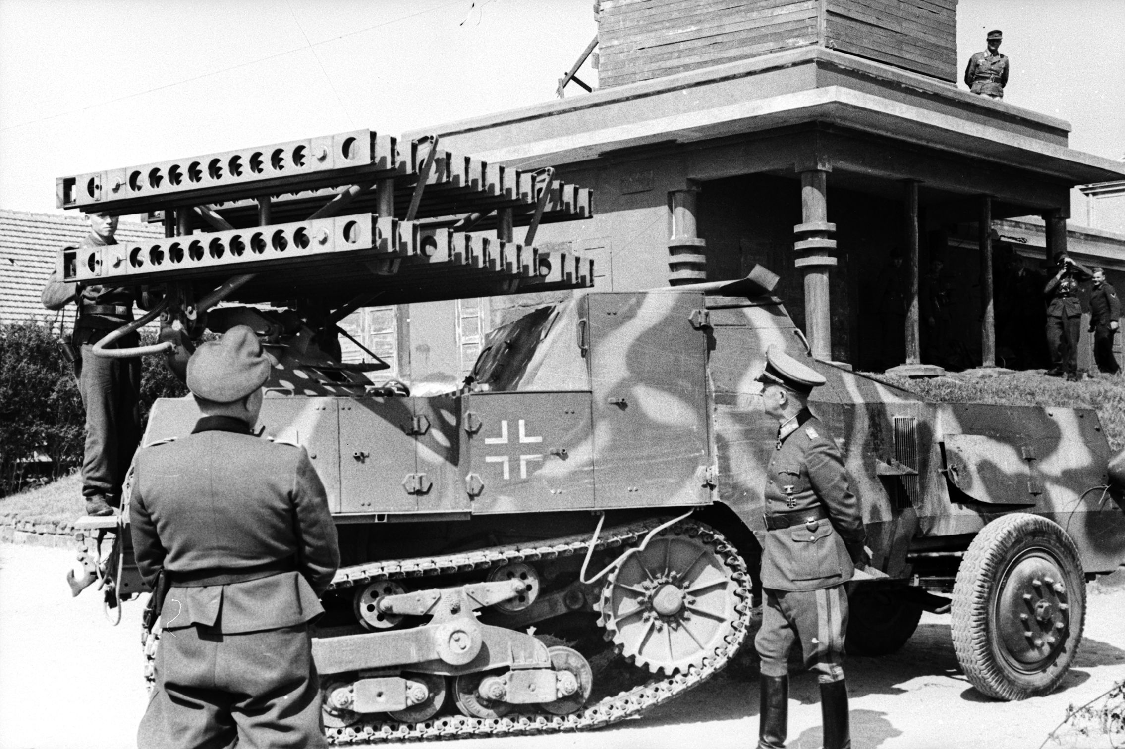 Becker (left) observes one of his designs: a multi-barreled rocket launcher known as a Vielfachwerfer, mounted on a French armored Somua MCG halftrack. Becker was skilled at converting captured enemy equipment into vehicles for German army use.