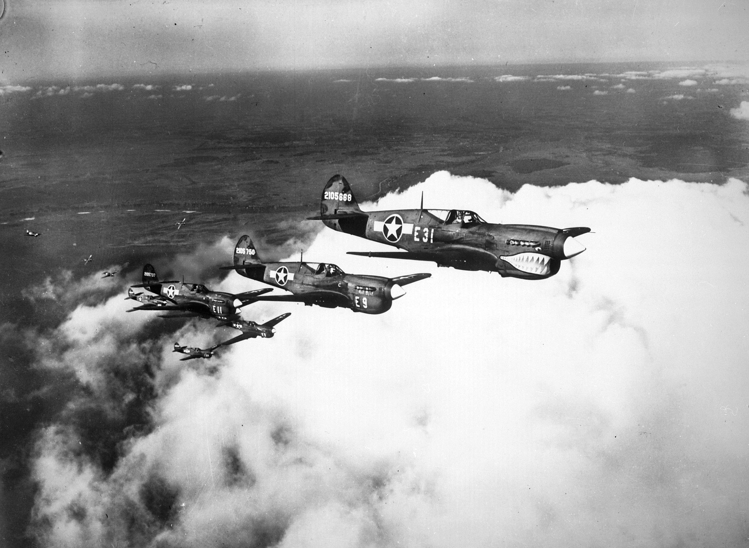 Before they were issued P-51 Mustangs in June 1944, the African American pilots of the 332nd Fighter Group flew obsolescent, shark-nosed P-40s, shown here, and then P-47 Thunderbolts.