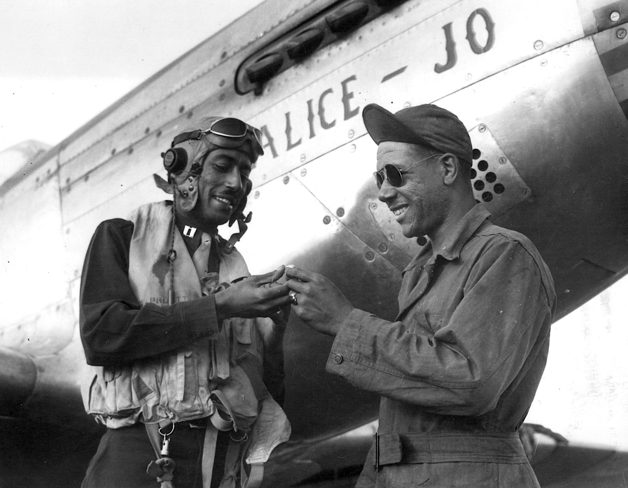 A captain with the Tuskegee Airmen gives his ring to his mechanic for safekeeping before going into battle. 