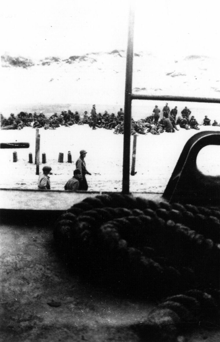German prisoners by the sea wall on Utah Beach. 