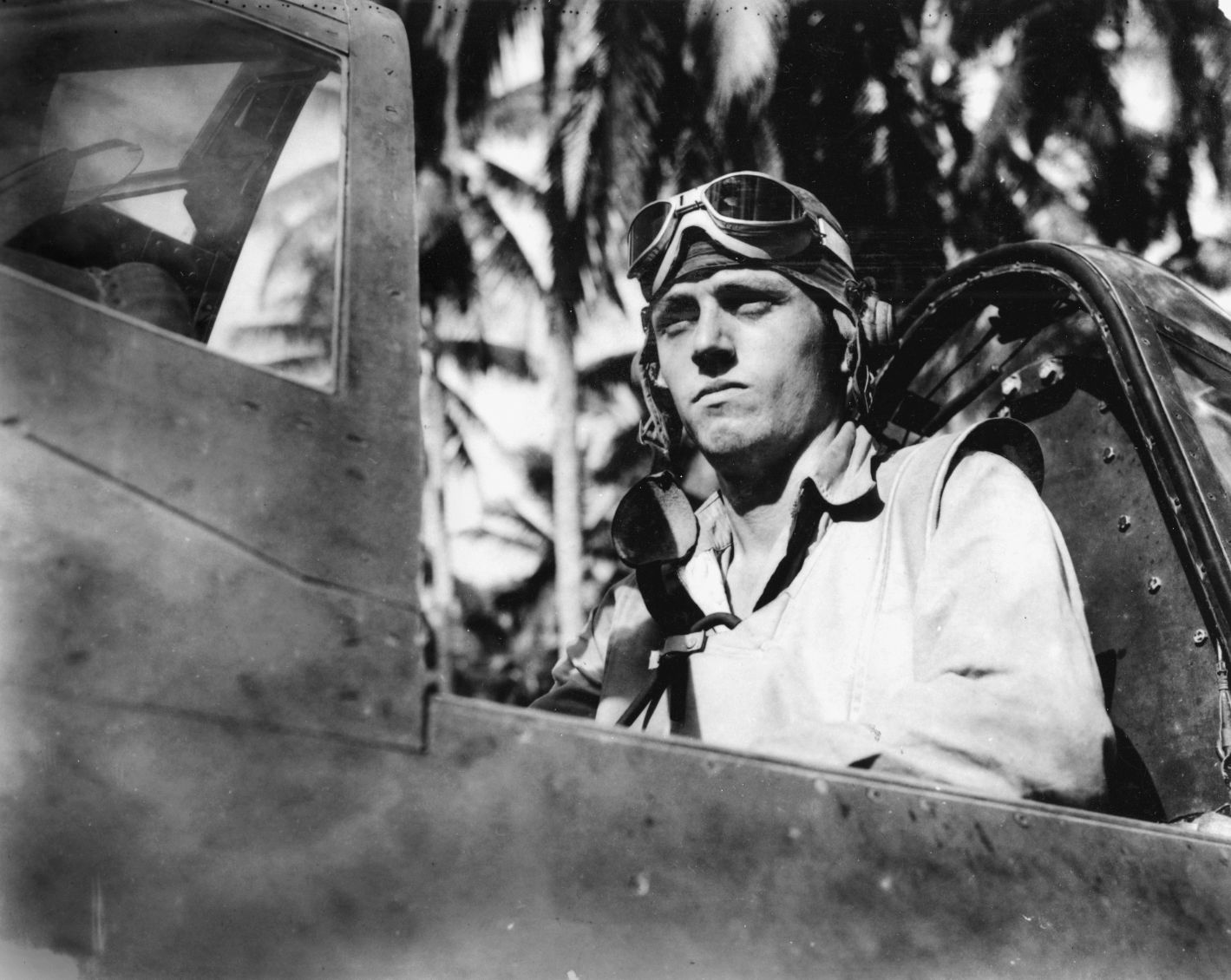Captain Thomas M. “Tommy” Tomlinson, a former Wildcat fighter pilot, sits in the cockpit of his Chance Vought F4U-1 Corsair fighter on Guadalcanal. The Wildcat helped hold the line against the Japanese during the early days of the Pacific War.