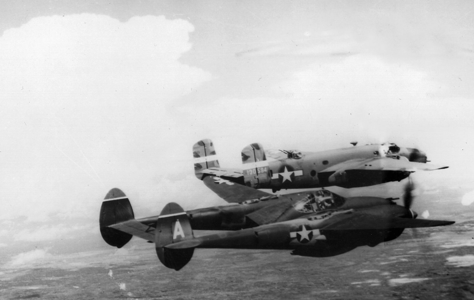 American-built P-38 and B-25 planes make a run over New Britain.