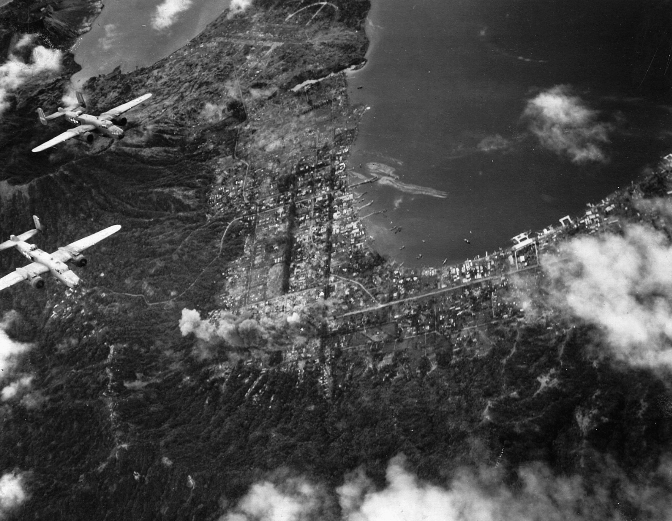 B-25 bombers in formation over the Japanese bastion at Rabaul in March 1944. Allied control of the skies was crucial during the three-year-long campaign.