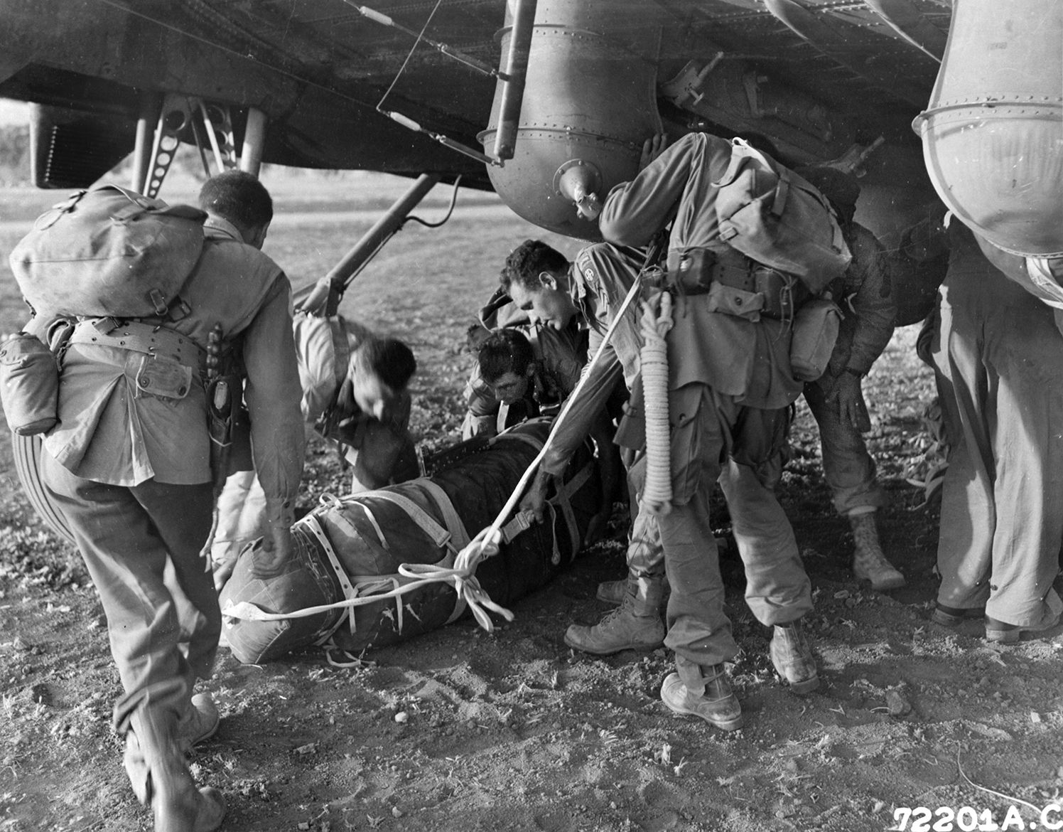 Paratroopers of the 82nd Airborne Division collect their gear and load aboard aircraft in preparation for their jump into Italy near Salerno on September 13-14, 1943. The airborne troops were inserted to reinforce the Allied Fifth Army invasion of the Italian mainland. 