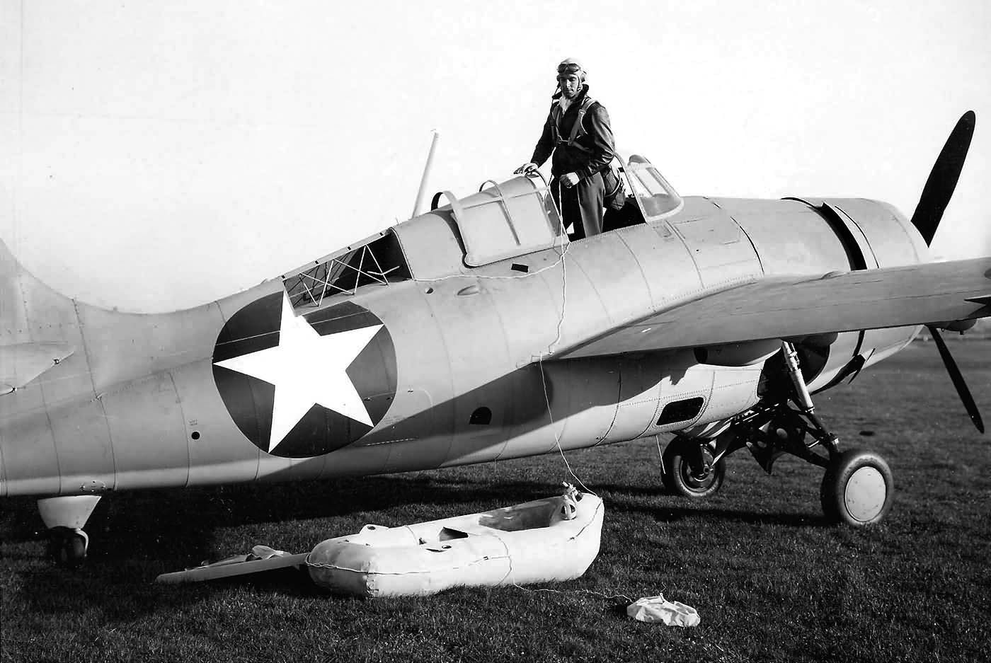An F4F Wildcat test pilot demonstrates the proper technique for deployment of a life raft after the Grumman fighter has been forced to ditch in the sea. Swett survived ditching his Wildcat after a fierce encounter with the Japanese.