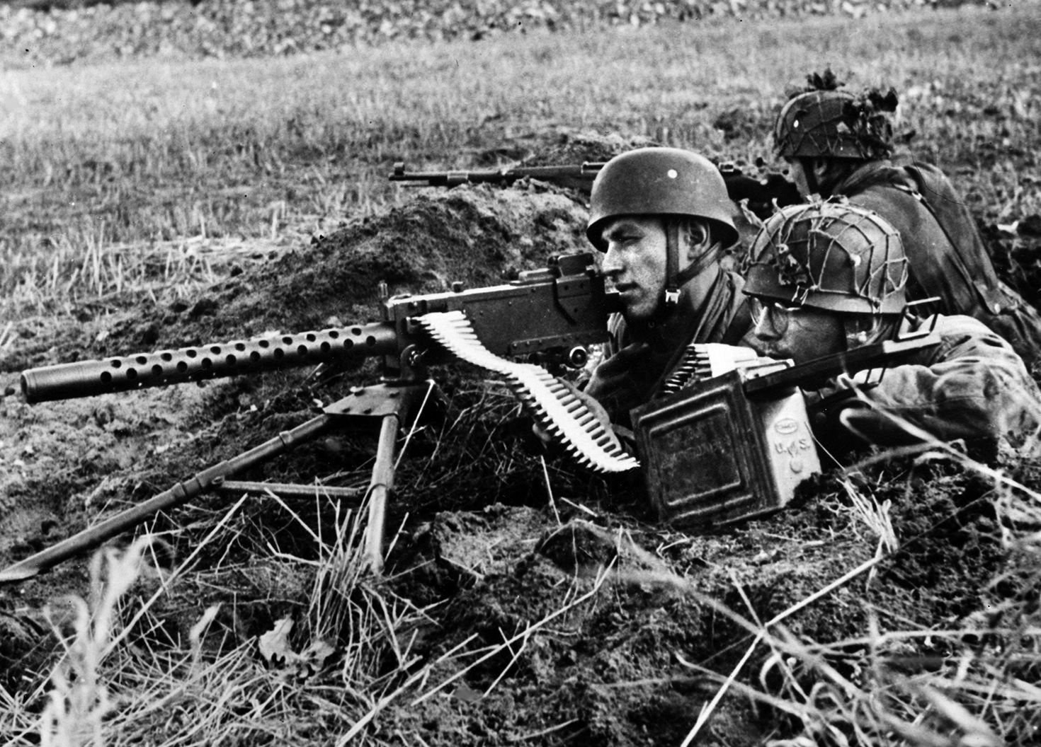 German paratroopers of the 5th Fallschirmjager Division fire a captured American-made Browning M1919 A4 .30-caliber machine gun during the fighting in Operation Market-Garden