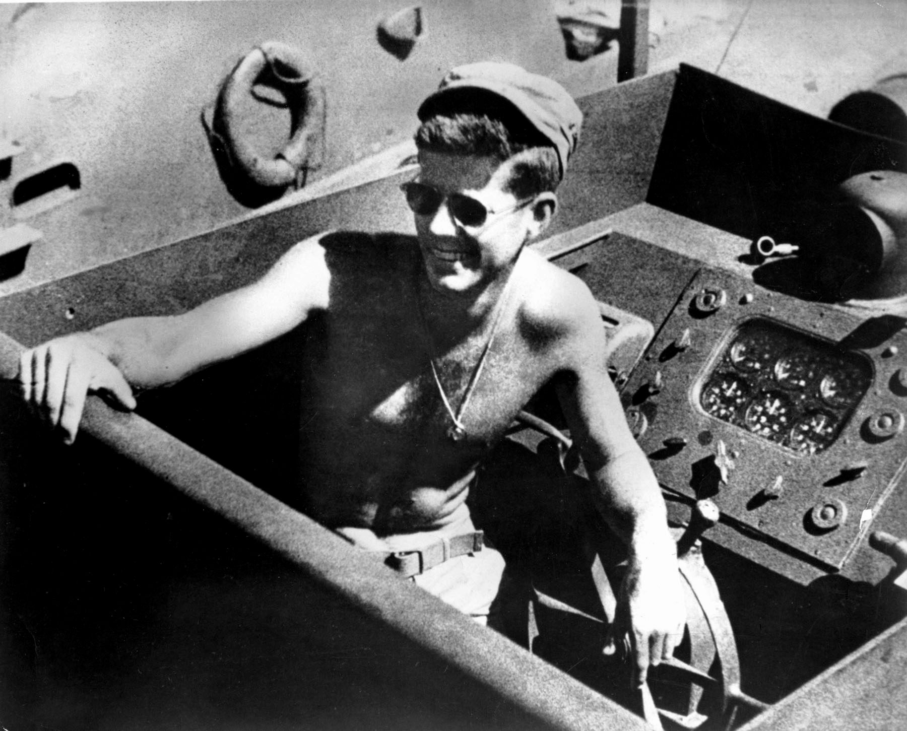 This iconic photo of Lieutenant (j.g.) John F. Kennedy was taken aboard PT-109 near the island of Tulagi in the Solomons in 1943. Kennedy displayed great leadership and command presence after PT-109 was sunk.