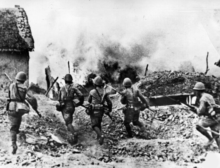 Japanese soldiers charge a British position during their swift conquest of the Malay Peninsula in late 1941 and early 1942. The 25th Army under General Tomoyuki Yamashita was relentless in its drive to Singapore and captured the fortress city from the landward side.