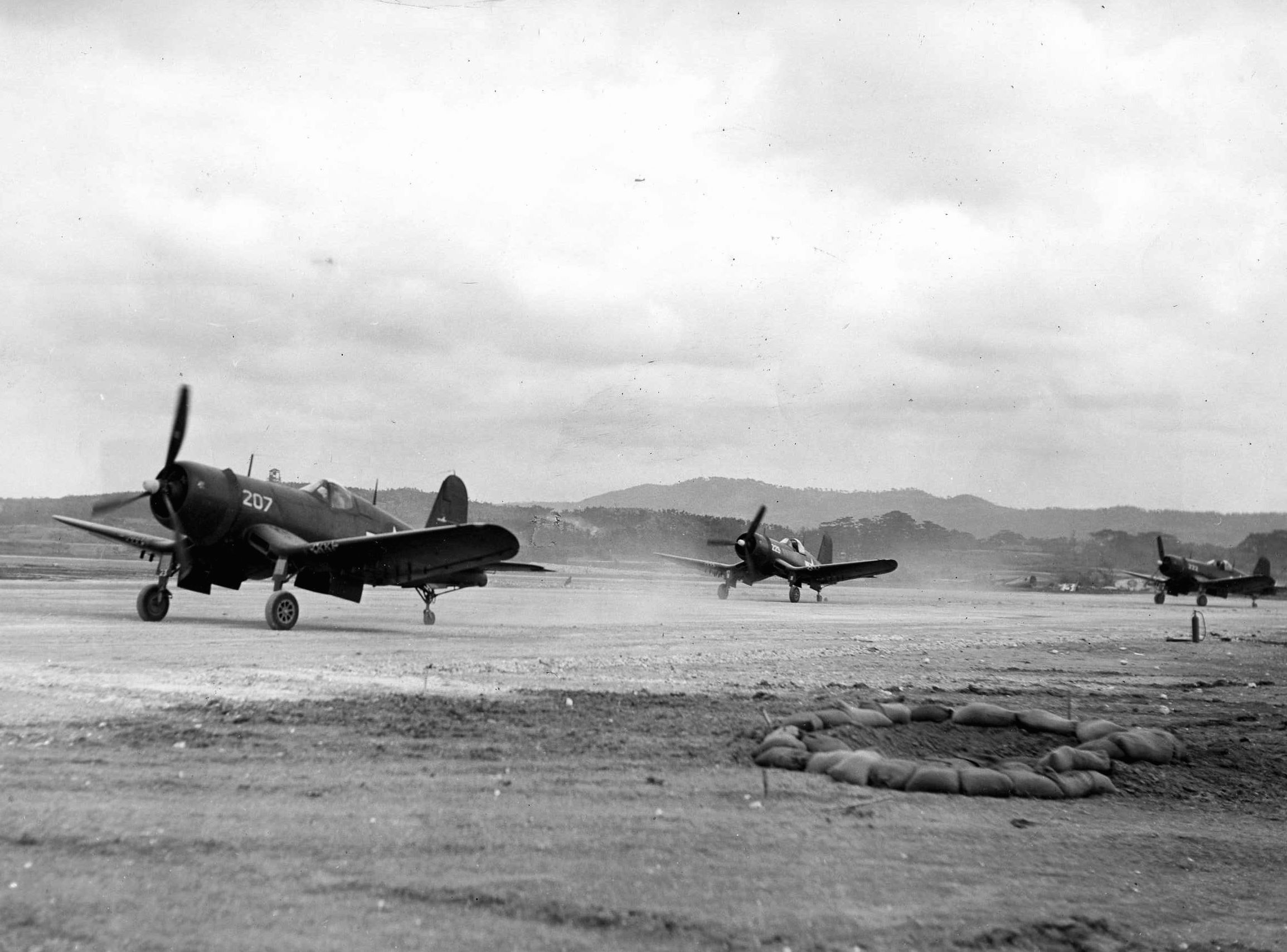 Vought F4U Corsair fighters line up for takeoff from Kodena Airfield on Okinawa on April 18, 1945. The Corsair remains one of the most famous fighter aircraft of World War II.  (National Archives)