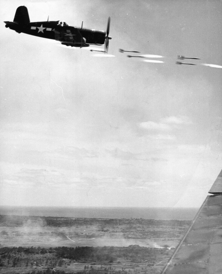 Firing a volley of rockets at a ground target on Okinawa, this Vought F4U Corsair delivers tremendous firepower. The Corsair was distinctive for its elongated nose as well as its gull wing structure.