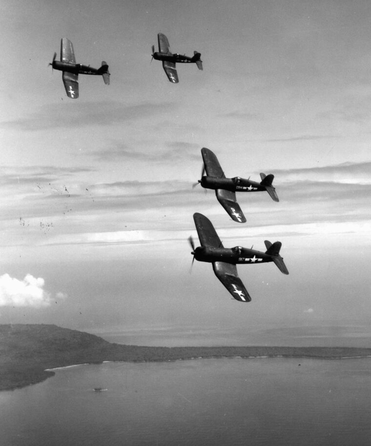 An imposing flight of Vought F4U Corsair fighter aircraft wings toward targets on a Japanese-held Pacific island. The Corsairs were formidable dogfighting aircraft but were equally adept at engaging ground targets. 
