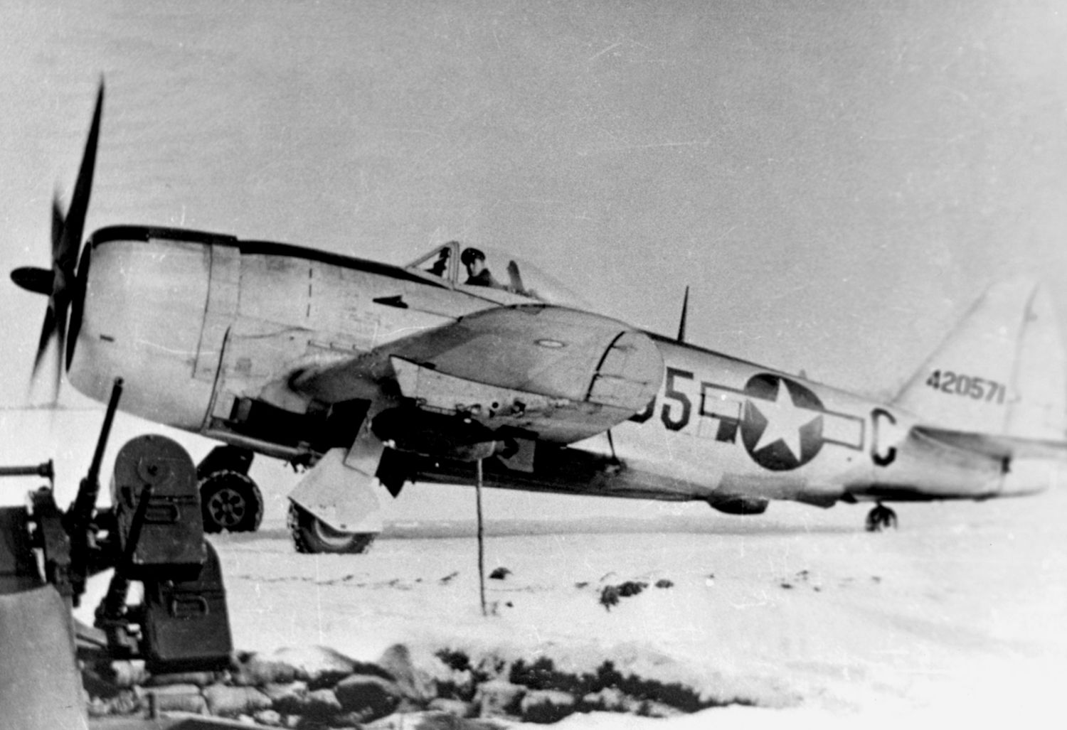 This is probably the most widely published photo of Grant Stout’s fighter group in action. Captain George W. King taxies his P-47D Thunderbolt in front of quad-mounted .50-caliber M3 machine guns at Chievres, Belgium.