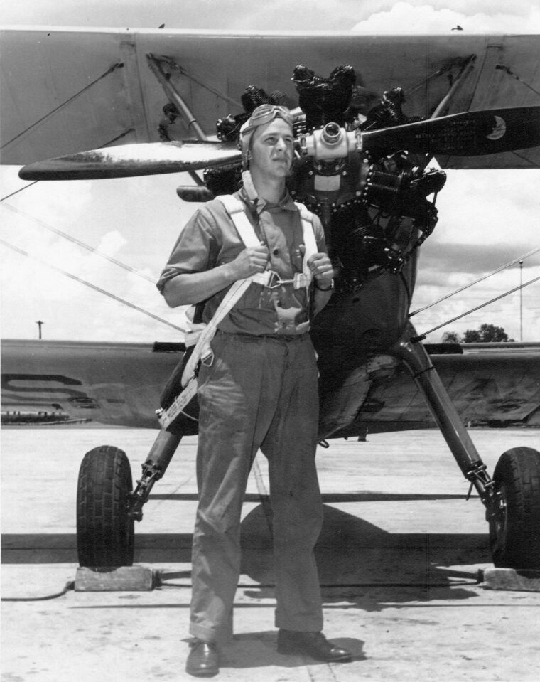 Not yet a second lieutenant or a pilot, student flier Grant Stout poses with the Stearman PT-17 Kaydet primary trainer that was the initial aerial classroom for so many.
