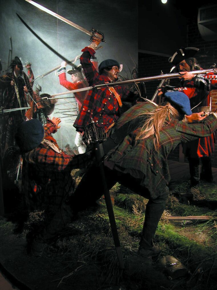 Embleton and his TMAG team created a little corner of the battlefield at Culloden for the Frazier Arts Museum in Kentucky. In the background is David Morier’s painting of the battle, generally agreed to be the best reference for Highland dress. At this period it is absolutely clear that clan tartans had not been developed.