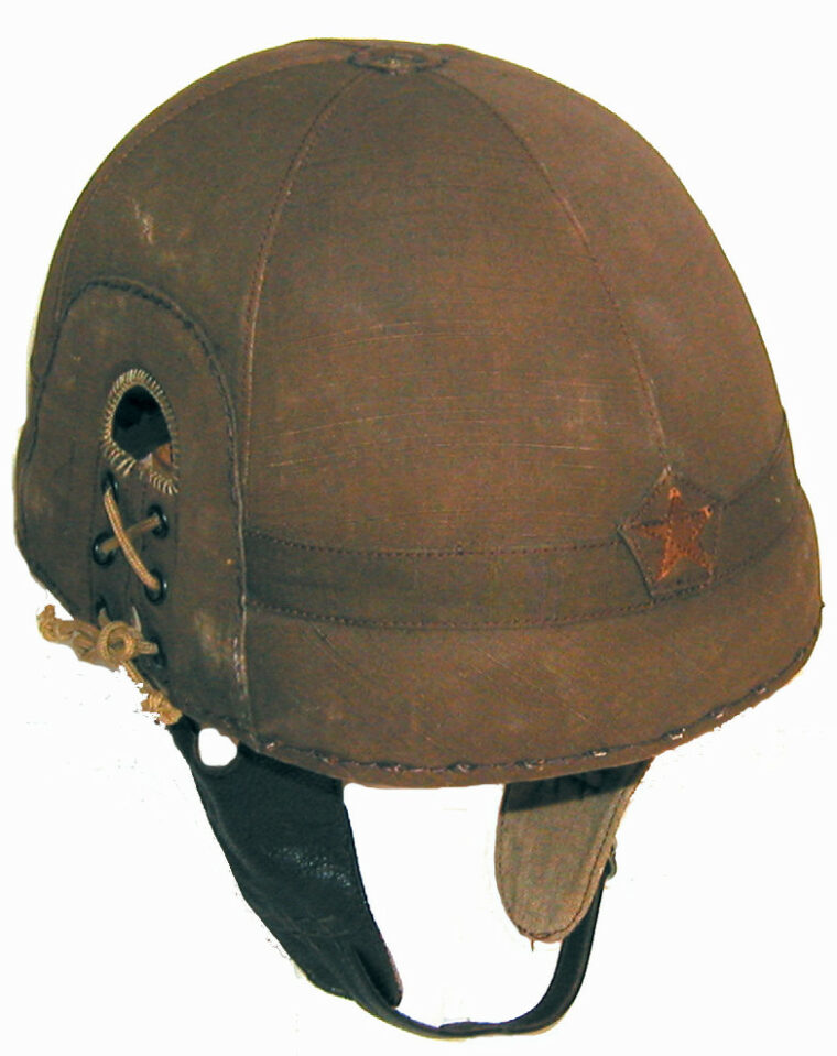 This Japanese tanker helmet was introduced in 1932 and made of waterproofed hemp. It features a padded leather liner with Japanese Army star affixed to the front. 