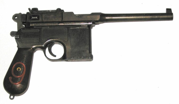 A Marushin counterfeit-gun replica of the classic German Mauser “Broom Handle” automatic pistol.