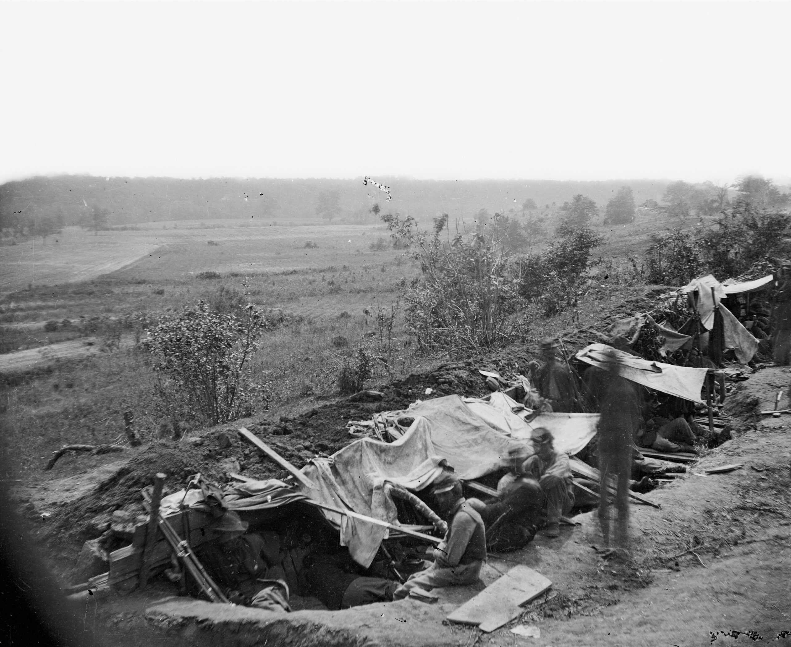 Federal troops occupy a line of simple breastworks on the north bank of the North Anna River in Virginia.