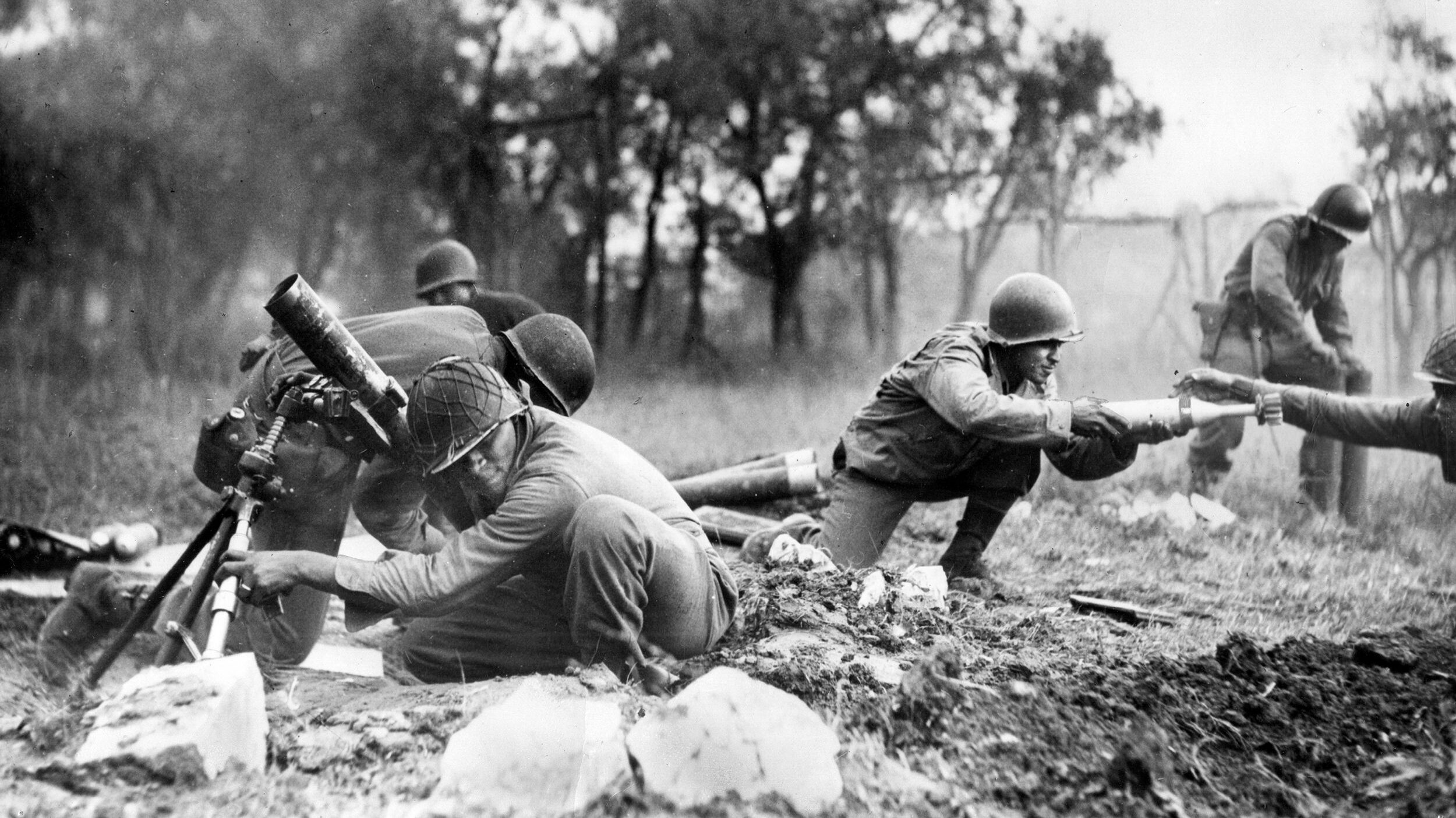 A 92nd Division mortar squad fires their weapons near Massa, on Italy’s west coast, November 1944.