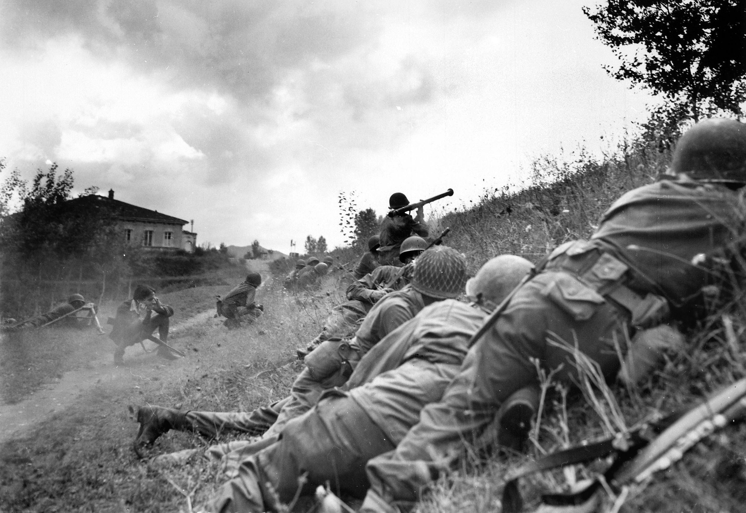 92nd Division troops fire a bazooka at a German machine-gun nest prior to attacking near Altopascio, Tuscany, September 1944. 