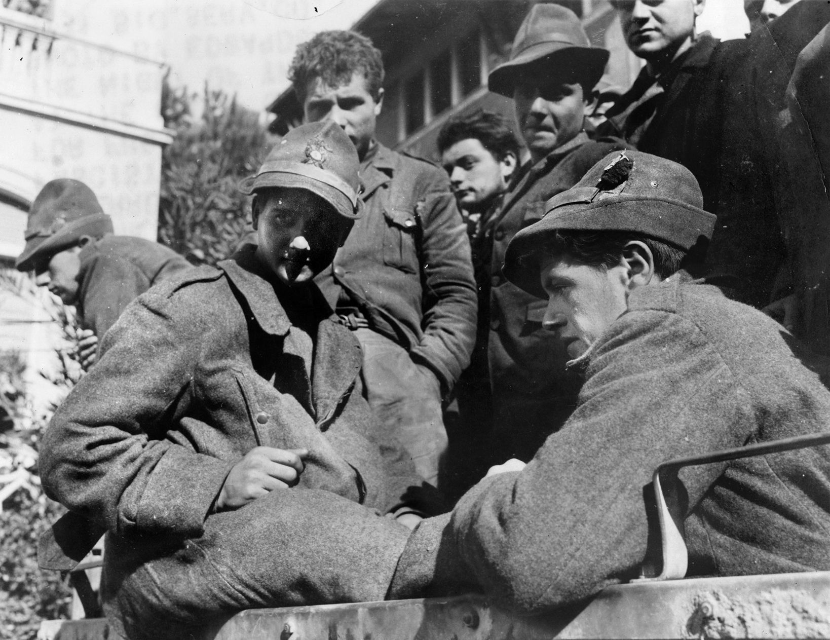 Young POWs from the Monte Rosa Division appear to be relieved at having deserted from their unit. They wear distinctive “alpini” hats common to Italian mountain troops.