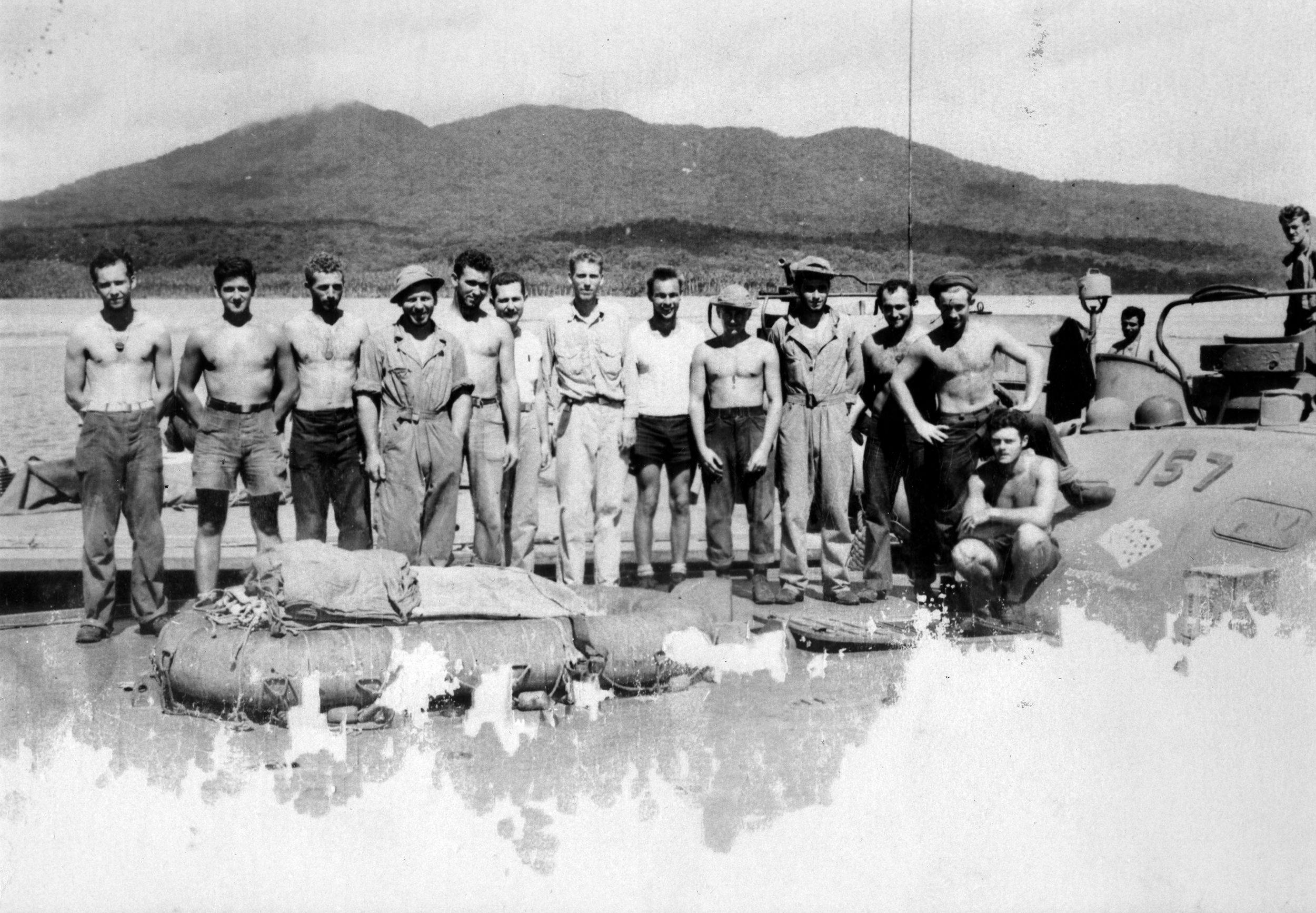 The crew of Elco-built PT-157 “Aces & Eights” poses for a photo at Rendova, Solomon Islands, while operating in support of the New Georgia operation, July 1943. The next month saw PT-157 and others engaged in a wild melee with IJN destroyers. 