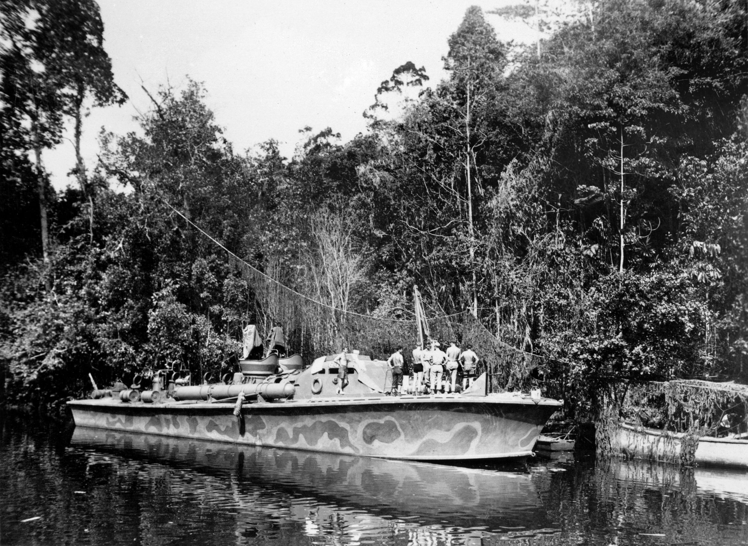 One of the “Green Dragon” boats docked in New Guinea prepares for a combat run. A number of PT boats were brought out of mothballs after the war to take part in Hollywood productions