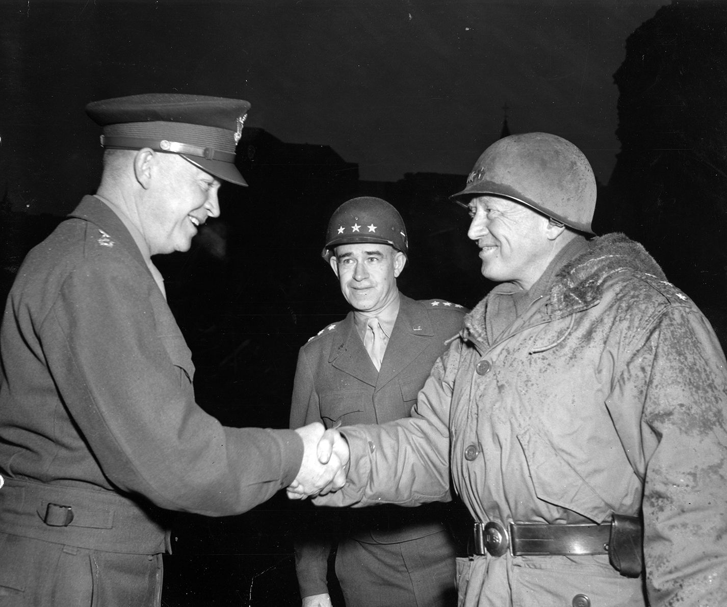 From left, Supreme Allied Commander General Dwight Eisenhower, Lt. Gen. Omar Bradley, and Lt. Gen. George Patton meet in Bastogne, February 5, 1945, after the crisis was over.