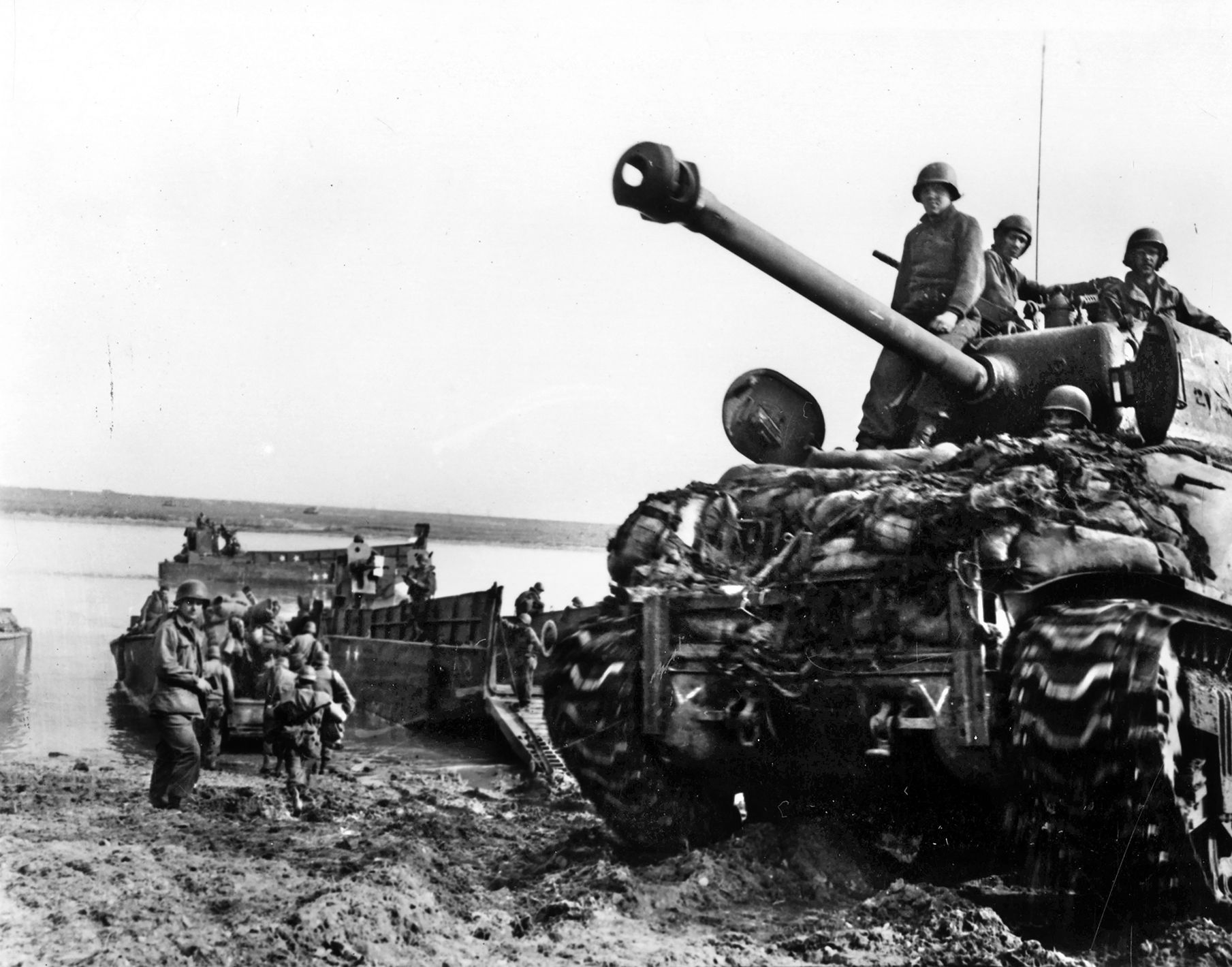 Farther north, British Field Marshal Montgomery pushed his troops, including Simpson's Ninth U.S. Army shown here, across methodically. Patton crowed about beating Monty to the rivers’s eastern bank. 