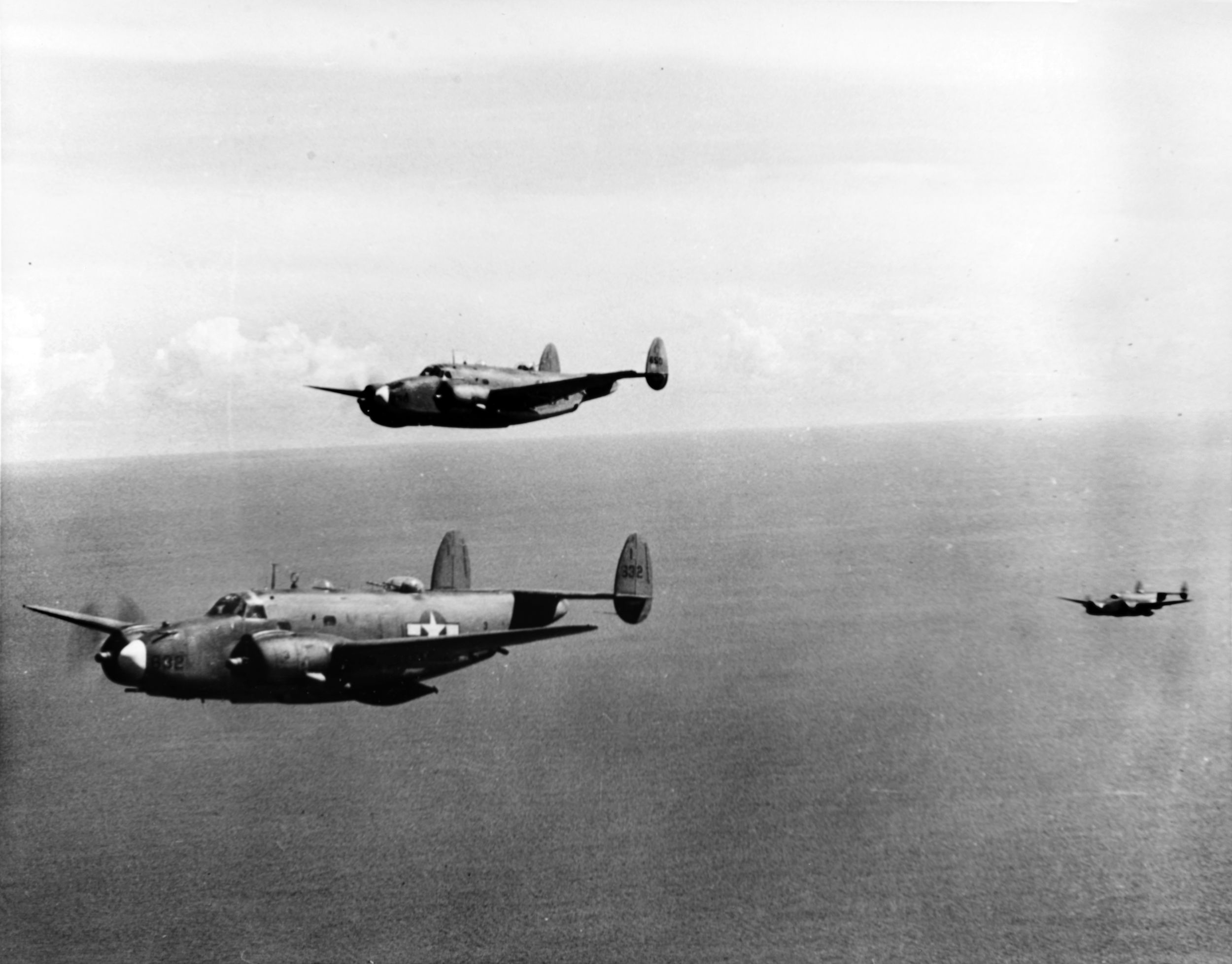 A pair of Lockheed Ventura bombers wings their way toward Brunei on the island of Borneo in early 1945. These aircraft are armed with rockets and bombs to carry out their mission.