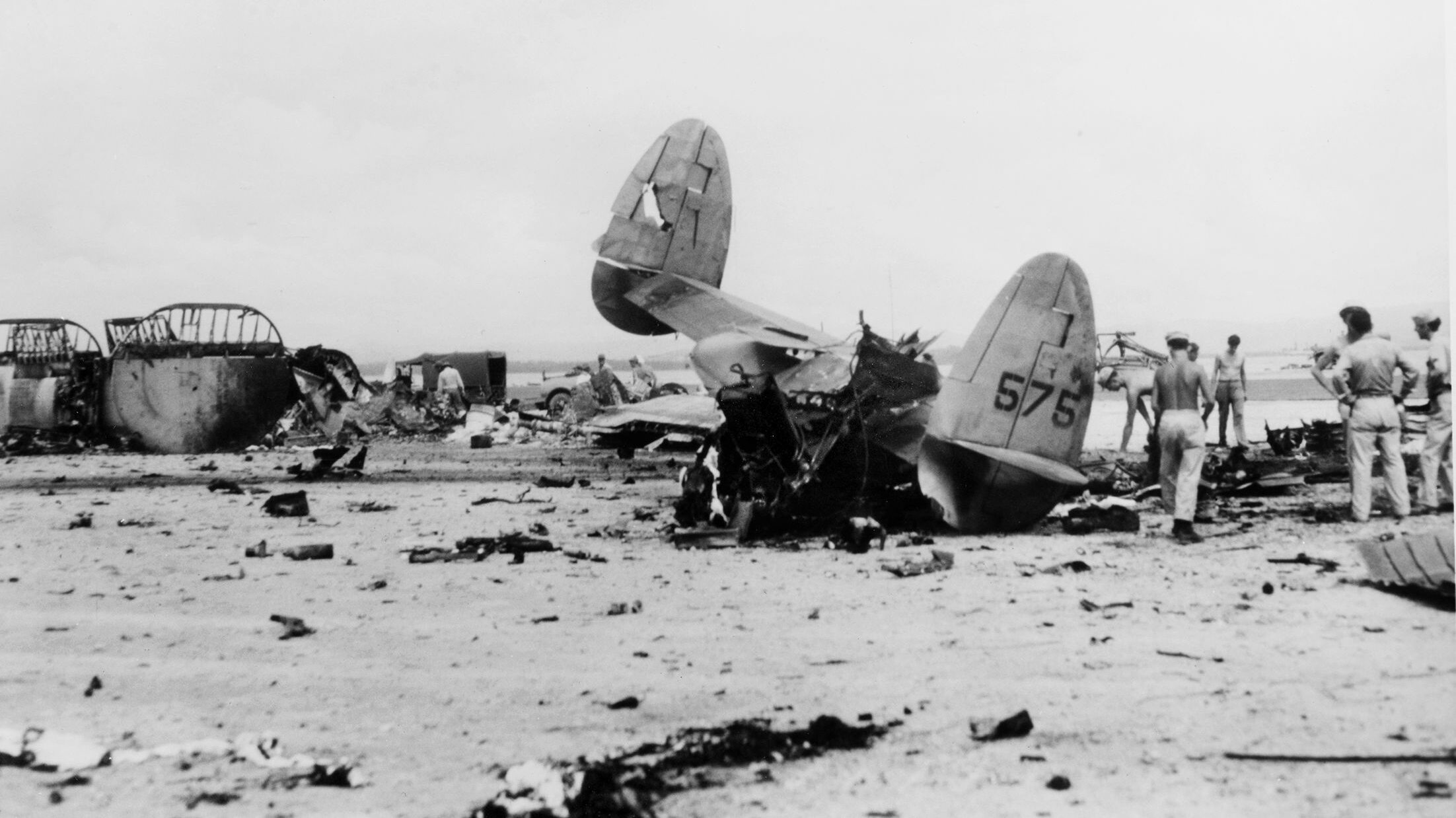 The tail section is all that is left of a Lockheed Ventura on the island of Leyte in the Philippines. This aircraft and others were victims of a Japanese raid that occurred during the final months of the war in the Pacific, probably in late 1944. 