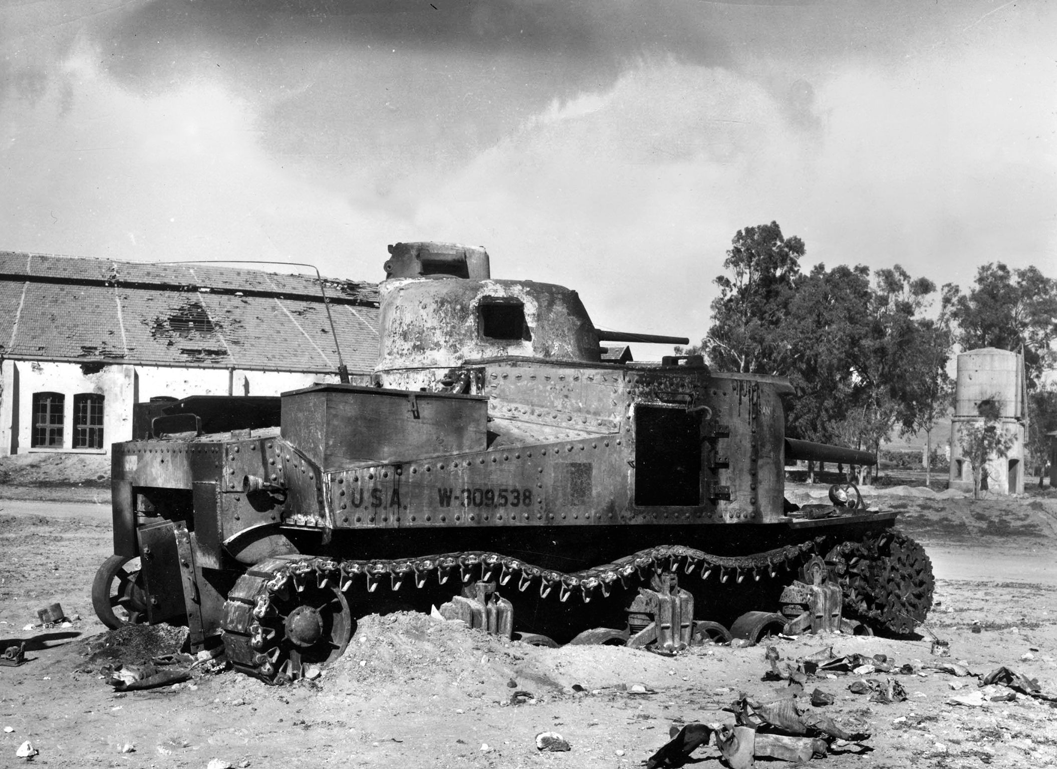 A destroyed M3 tank sits abandoned in Tunisia in February 1943. This tank had taken a direct hit from a German 88mm gun. The British used the Grant tank to good effect prior to receiving the M4 Sherman medium tank.