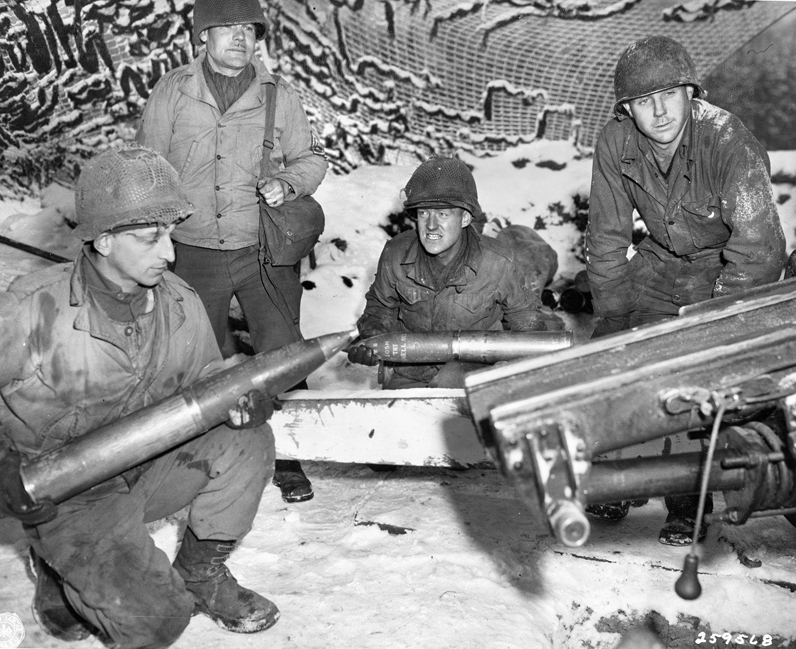 These American artillerymen of Battery A, 19th Field Artillery Regiment, 5th Infantry Division pose with 105mm shells at the ready. Their howitzers provided significant support for the Third Army drive to Bastogne, and American artillery performed superbly throughout World War II. 