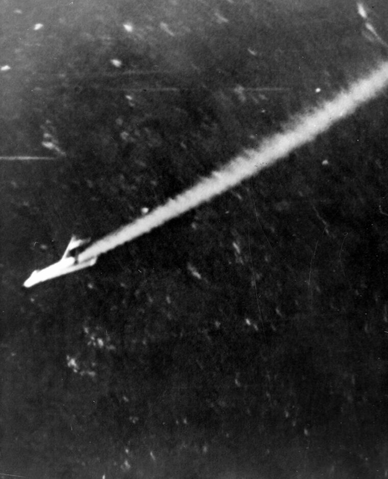A Soviet MiG-15 is shot down by a burst of tracer rounds from a Navy F9F Panther over Korea in November 1950.
