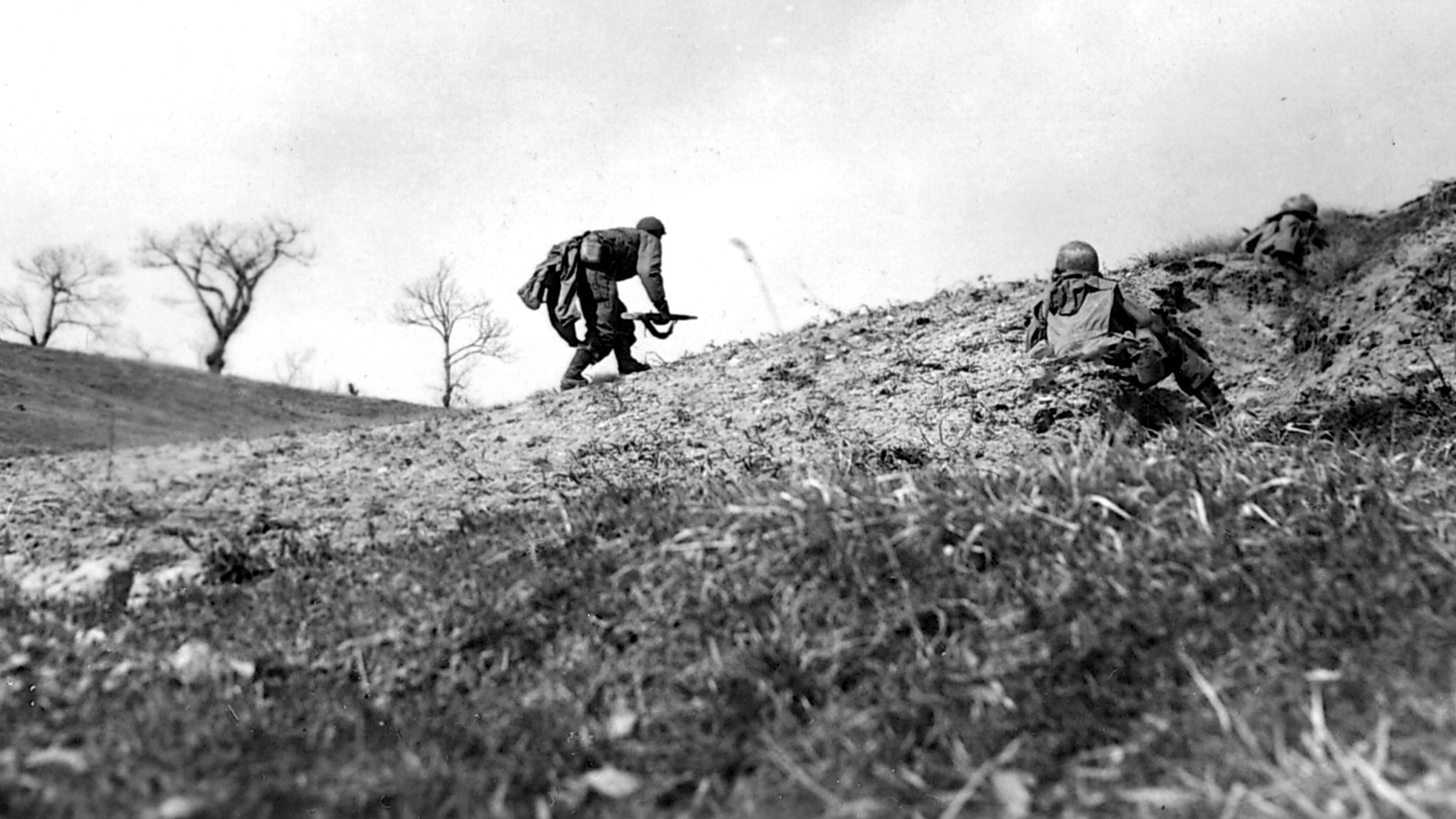 On March 4, 1945, soldiers of the 10th Mountain Division advance cautiously toward German positions at Sassomglare, Italy. The ranks of the 10th Mountain included some of the finest skiers in the world, but the troops also fought as regular infantry.