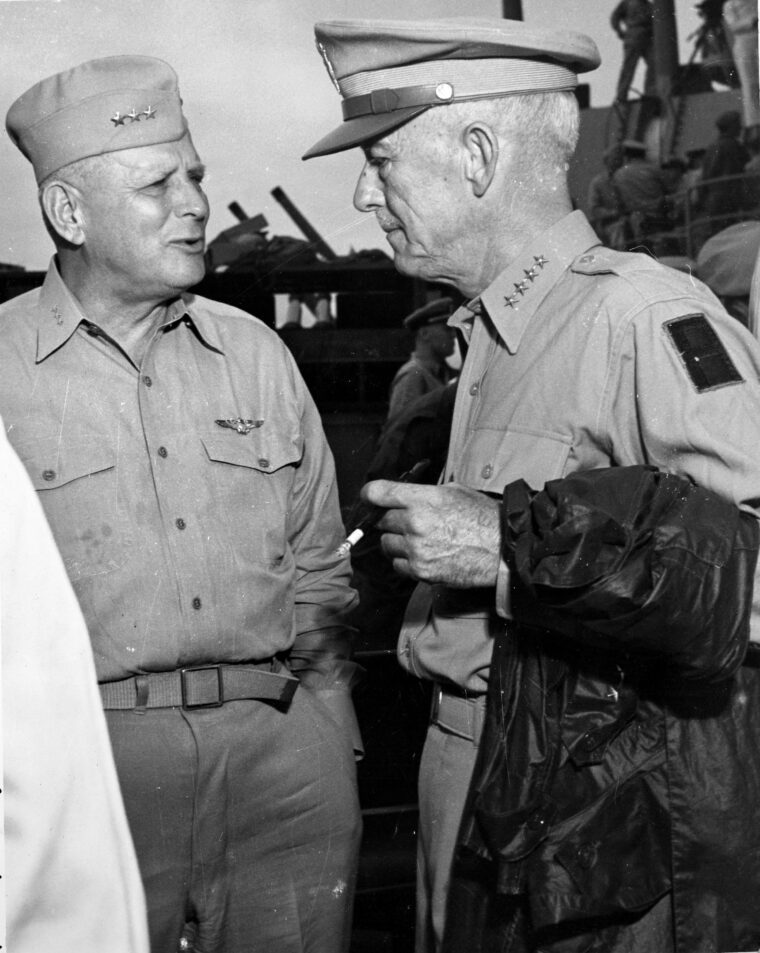 U.S. Marine General Roy Geiger, left, commander of the Fleet Marine Force, chats with General Courtney Hodges, commander of the U.S. Eighth Army, following the surrender of Japan aboard the battleship USS Missouri in Tokyo Bay on September 2, 1945.