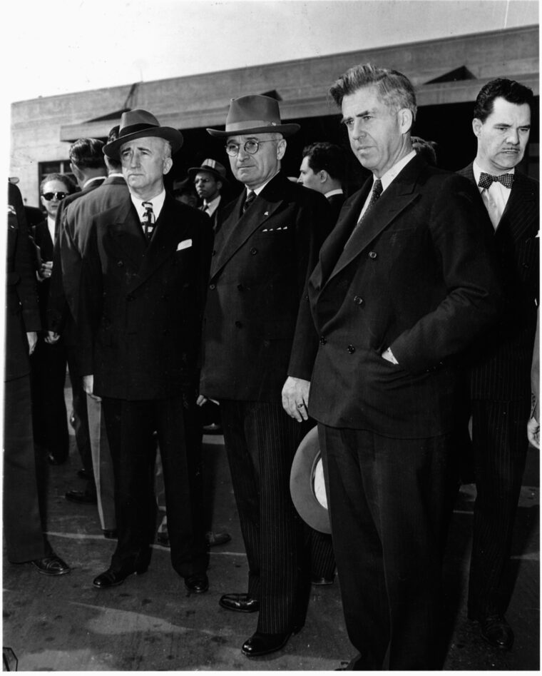 Flanked by Jim Bynes (left) and Henry Wallace (right), President Harry S. Truman waits at Union Station in Washington, D.C.