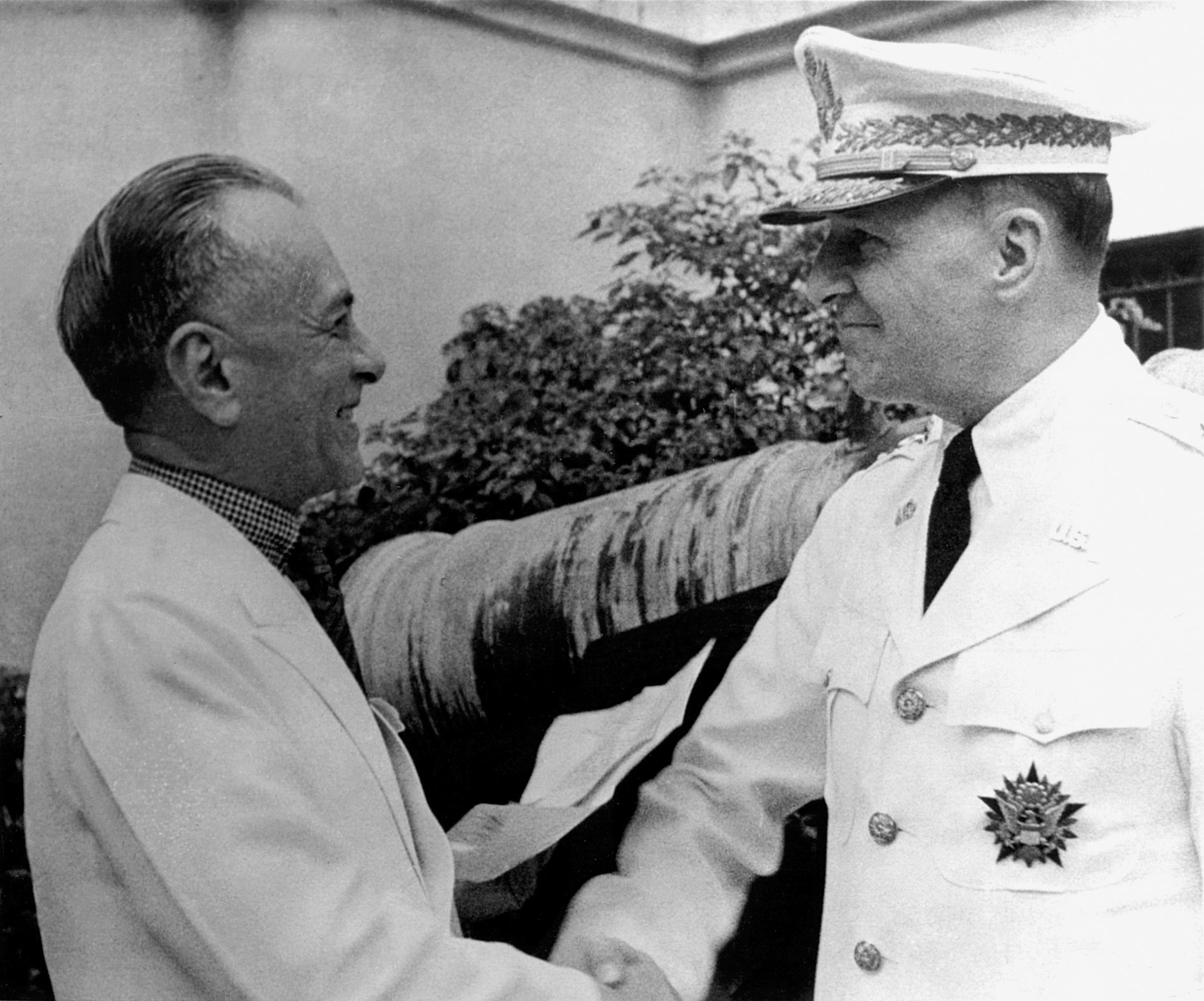 General MacArthur and Filipino President Manuel Quezon greet each other cordially. 