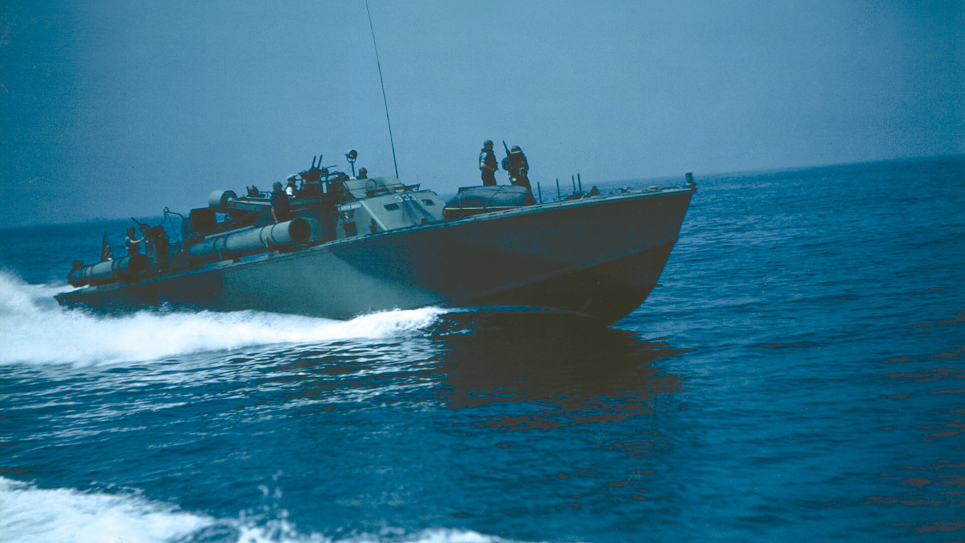 During the daring mission to evacuate General Douglas MacArthur from the Philippines, a PT boat slices through the Pacific Ocean at high speed.