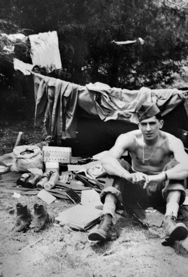 Waiting for his laundry to dry, Sergeant Frank Lembo is photographed while serving in Western Europe with the 305th Engineer Combat Battalion, 80th Infantry Division, an outfit of the U.S. Third Army. 