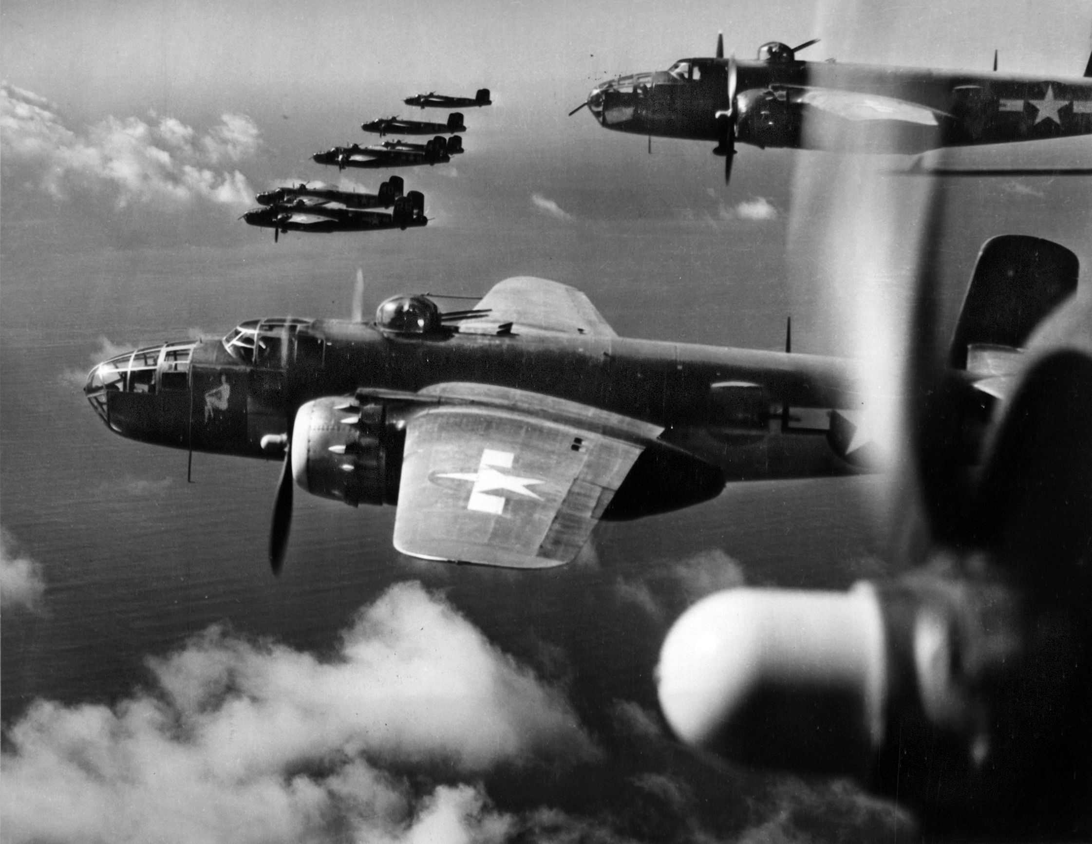 A squadron of B-25 bombers speeds its way toward a rail yard, the target of this mission during the Italian campaign. The B-25s regularly bombed rail yards in northern Italy to prevent the movement of German reinforcements and equipment toward the front lines to the south.