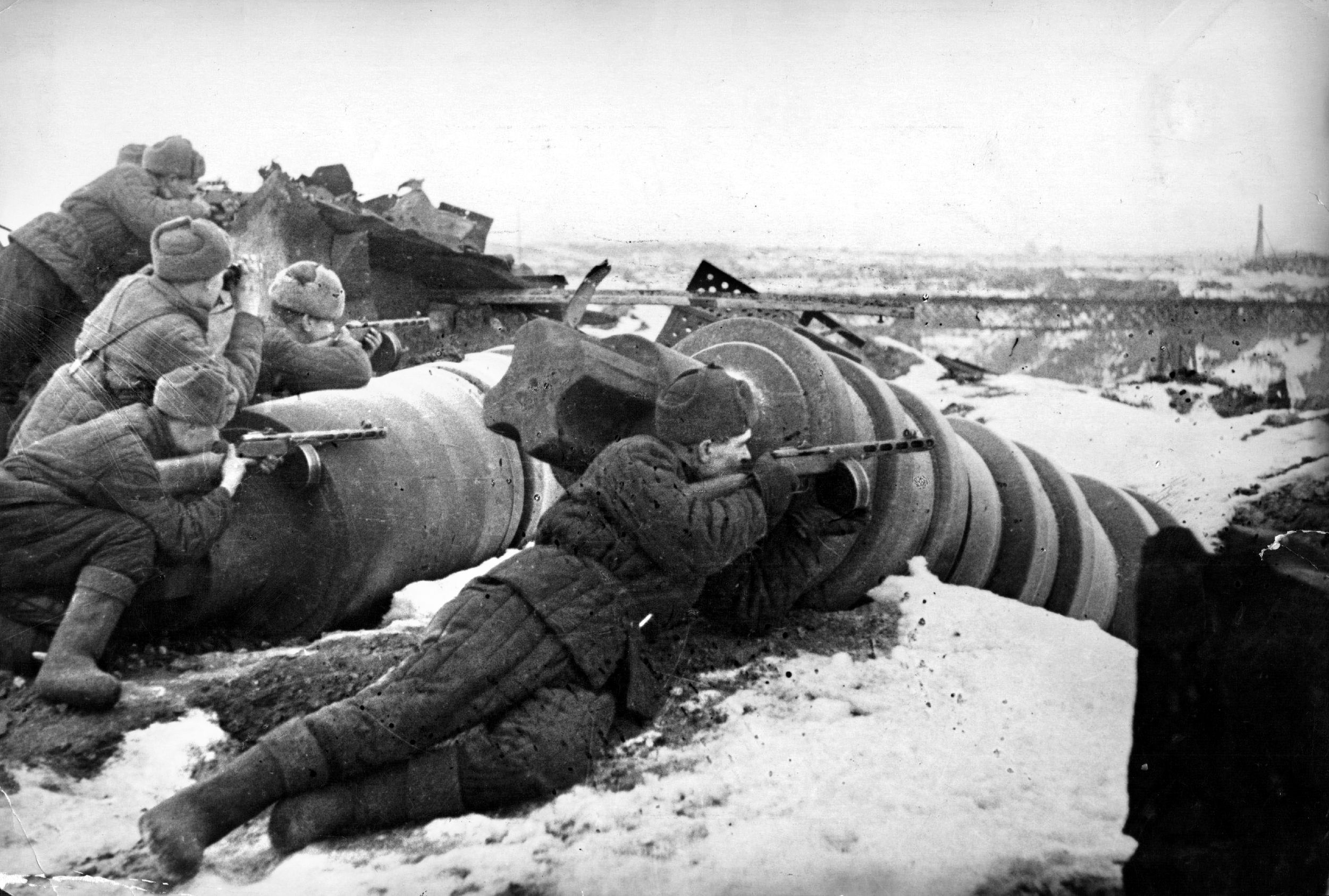 The Red October factory was destroyed during the fighting for control of Stalingrad, the industrial city on the banks of the Volga River. Here, Red Army soldiers take cover in the rubble as they prepare to fire on the German enemy.
