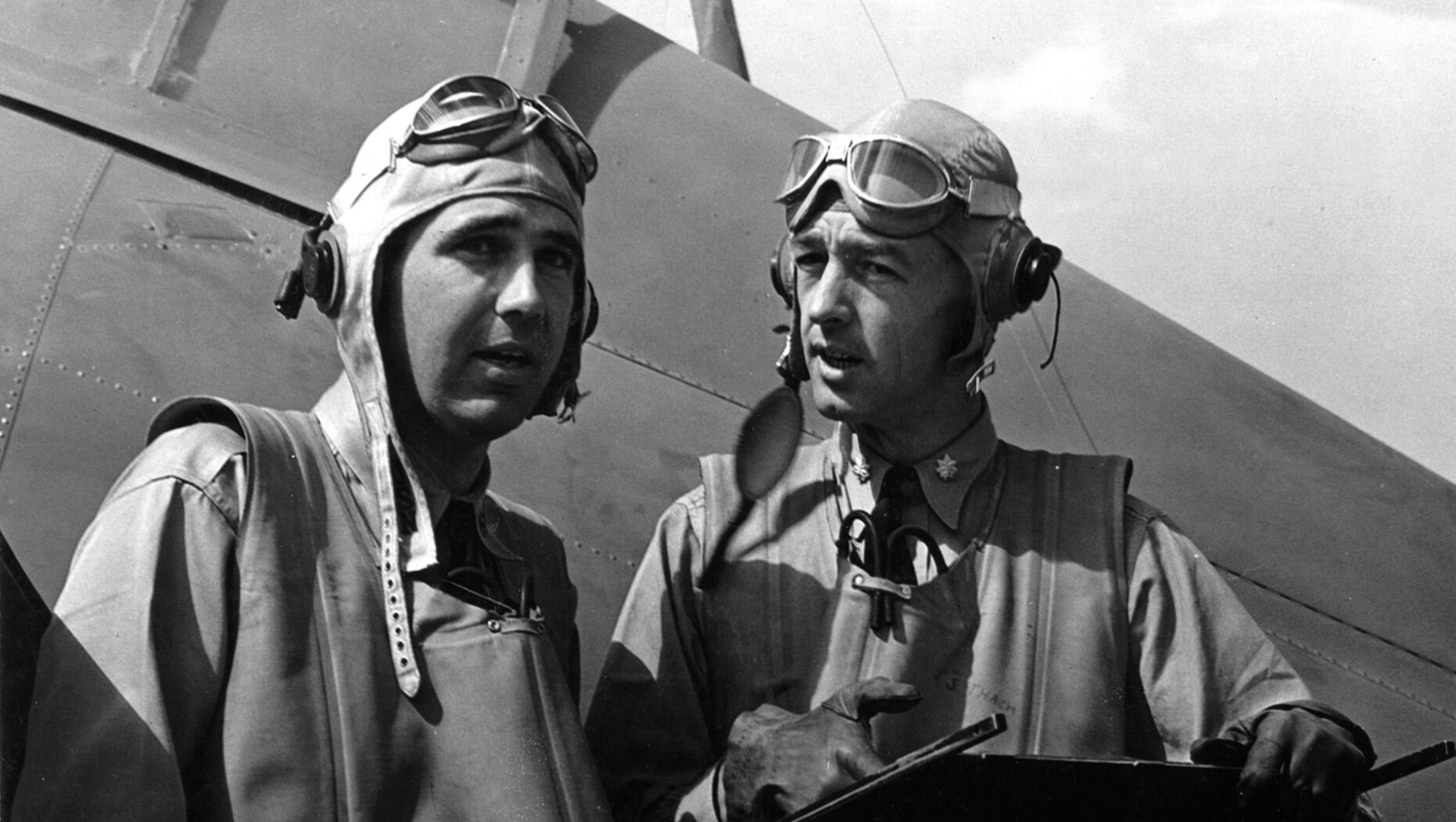 O’Hare (left) discusses fighter tactics with a fellow pilot after returning from a mission.