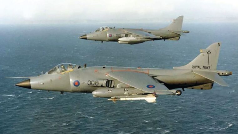 Sea Harrier FRS.1s XZ451 (foreground) and ZA176 flying in “Operation Corporate,” the former using its AIM-9L Sidewinders, which it is seen carrying here, to shoot down several Argentine aircraft, including a Canberra B-108 bomber on May 1, 1982, and a C-130 Hercules transport on June 1.