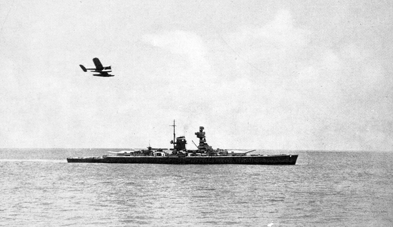 The Scheer steams ahead, while its Arado float plane flies above. The Arado performed aerial reconaissance duties for the surface raider.   