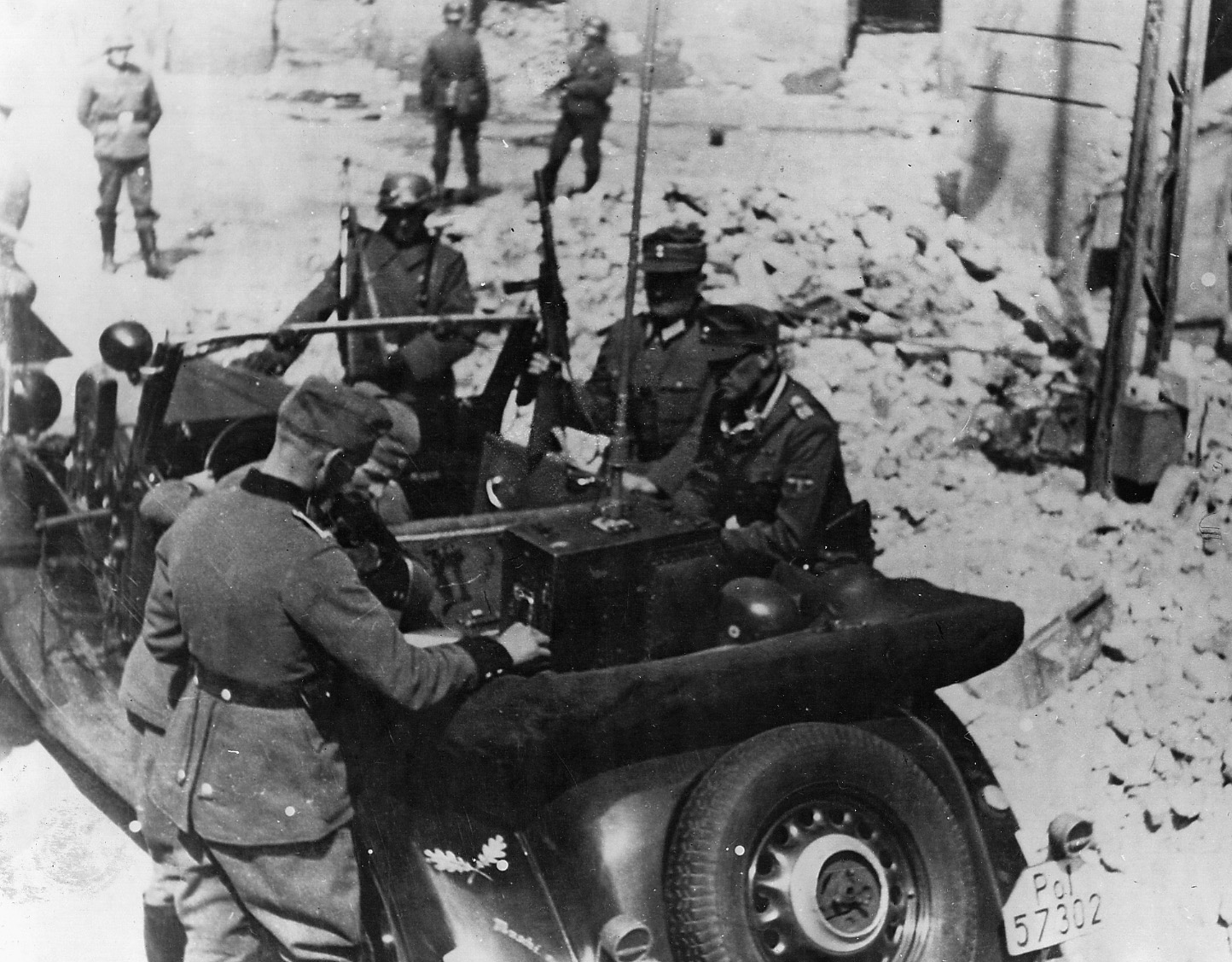 SS officers gather to coordinate an attack on the ghetto.