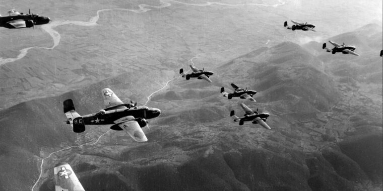 A squadron of B-25 “Mitchell” medium bombers fly in formation over the Italian countryside. Lieutenant Ben Ernst (inset) of Nashville, Tennessee, joined the Army Air Force for the “glamour,” but was shot down off the coast of Palermo, Sicily, in 1943 and spent 23 months as a prisoner of the Germans.