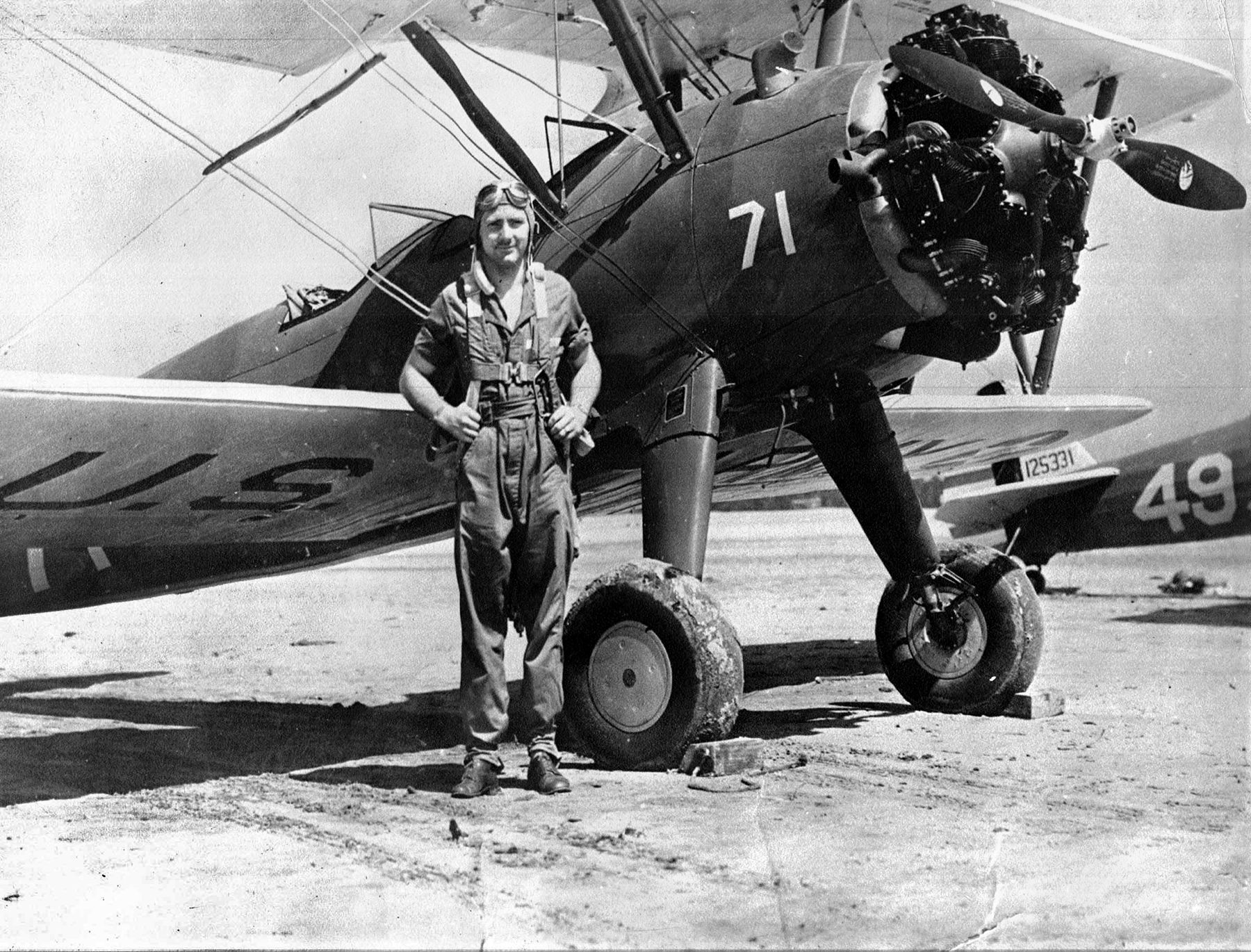 Posing for a photo, Ben Ernst stands in front of his Stearman PT-13D “Kaydet” trainer during flight instruction (probably at Maxwell Field, Montgomery, Alabama) in 1942. He wanted to be a fighter pilot but was assigned to B-25 bombers instead. 