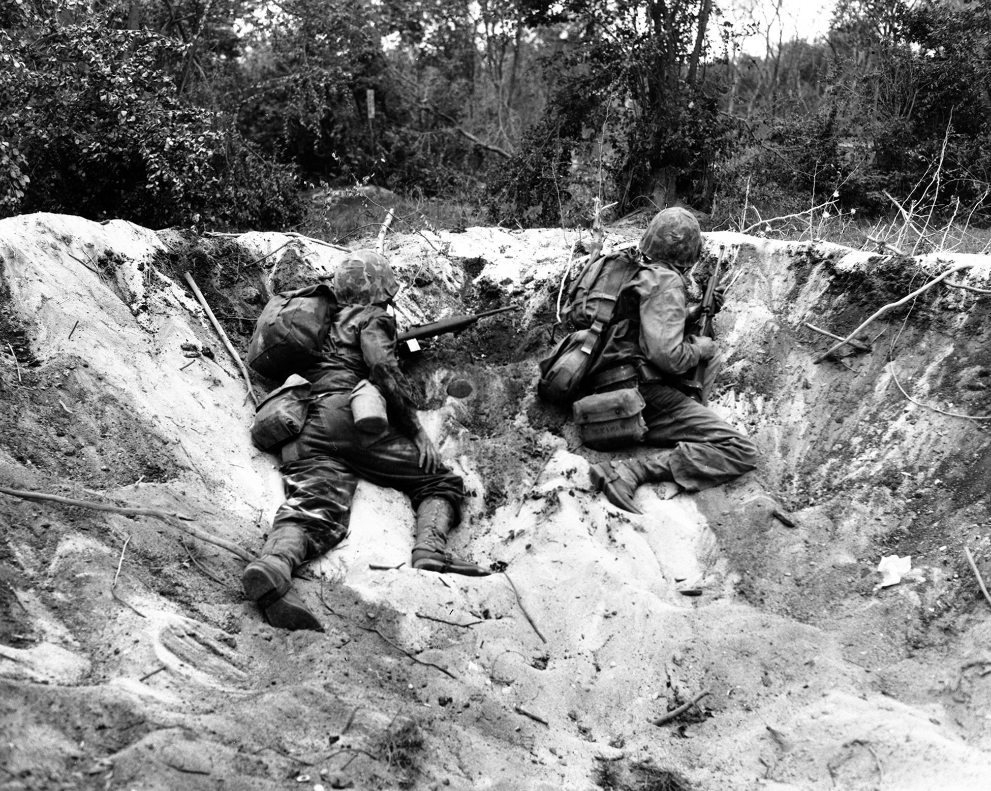 U.S. Marines in a shell hole search for snipers on the Pacific island of Saipan. Private Lee Marvin was wounded June 18, 1944, during the assault on the island’s highpoint, Mount Tapochau. “In 15 minutes, the company was reduced from 247 men to six,” Marvin recalled.
