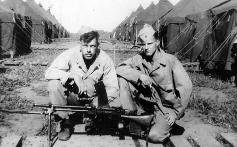 Private Lee Marvin, left, and an unidentified Marine pose with a Japanese machine gun in the Pacific in 1944.