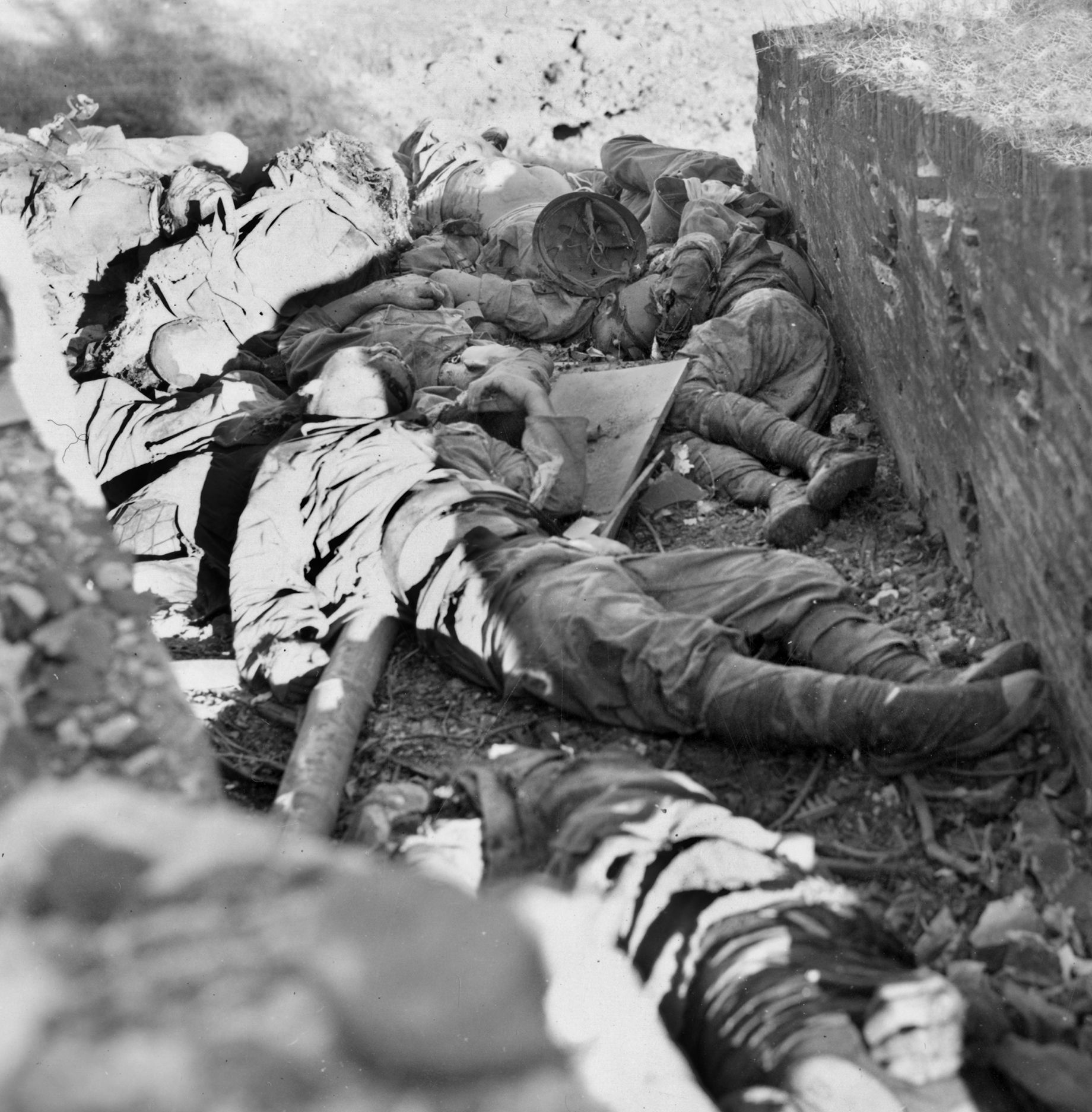 The bodies of Japanese soldiers killed in the heavy fighting in Manila lie unburied in a heap on February 22, 1945. The Japanese are known to have committed numerous atrocities against Filipino civilians during the battle for the city.